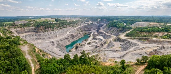 Aerial view of a quarry with a turquoise water pool in the Savanna Rapids Park, Georgia, USA