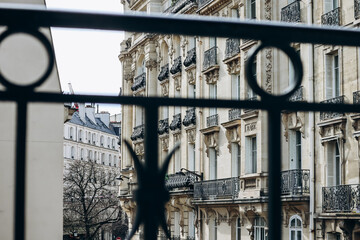 Paris, France - 14 March 2024: View from the balcony of a Parisian apartment onto a street in the 17th arrondissement of Paris