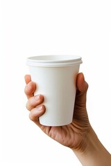 Obraz premium photo of a Closeup of hand holding white paper coffee cup isolated on white background, photo 