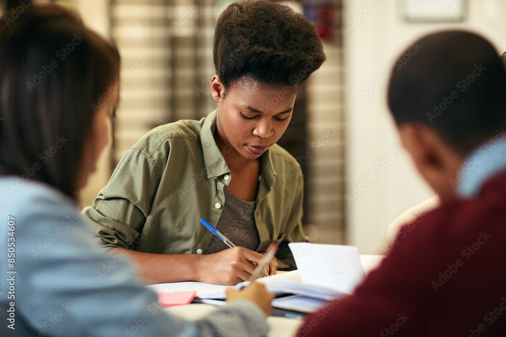 Poster writing, notes and group of students in library for university education, teamwork or school project