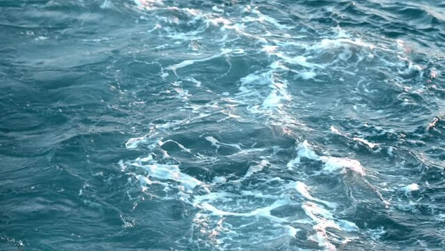 Storm on the sea. White foam on Powerful stormy wave with wind and High waves ocean. White foam on wind. Wind breaks waves. Splashes Atlantic sea