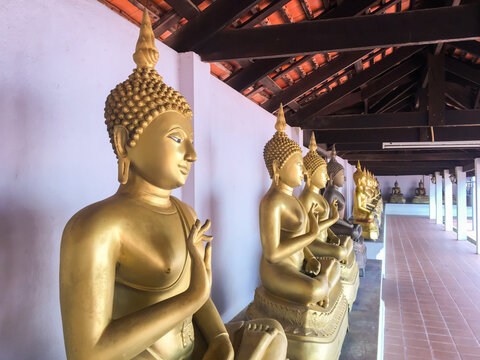 Golden Buddha statue in Phra Borommathat Sawi Temple.