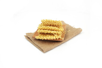 dry noodles, egg noodles, isolated on a white background
