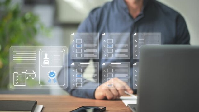 man at computer takes driving license test examination online,person fills out questionnaire on virtual graphic screen gives right answer and gets the car driver licence on internet