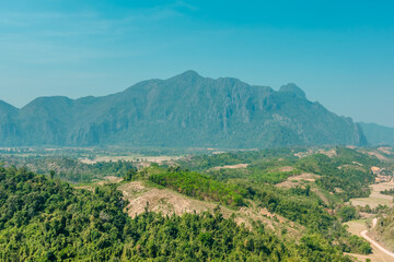 Fototapeta premium Panorama view of the karst mountain landscapes of the surroundings of Vang Vieng, Laos