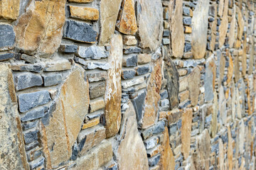Stone wall texture in daylight. Banner background, backdrop or texture .