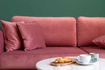 Selective focus on marble countertop of coffee table with breakfast