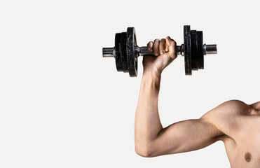 Thin man in sports with dumbbells. Weak man lift a weight, dumbbells, biceps, muscle, fitness. Nerd...