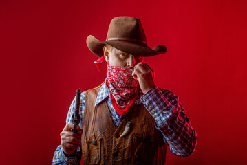 American bandit in mask, western man with hat. Portrait of man wearing cowboy hat, gun, macho....