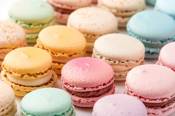 Obraz premium A close-up of various sweet colorful macarons stacked together