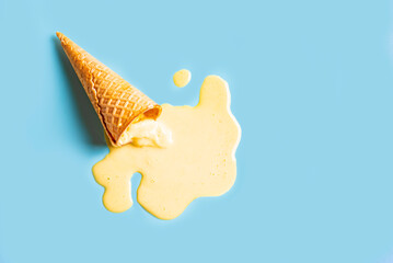 waffle cone with melted yellow ice cream