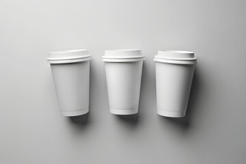 White Paper Cups Mockup set top view on grey background.