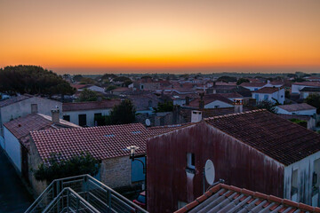 Rooftops and houses of the village of La Cotinière in Saint-Pierre-d'Oléron, France at sunset