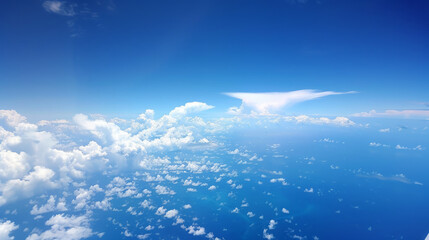 From the passenger seat of a plane, you can see a breathtaking view of the blue sky. It's a reminder of the vastness of the world and the wonders of air travel.