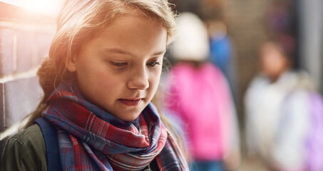 Bullying, lonely and outcast with child student in hallway of school for depression or mental...