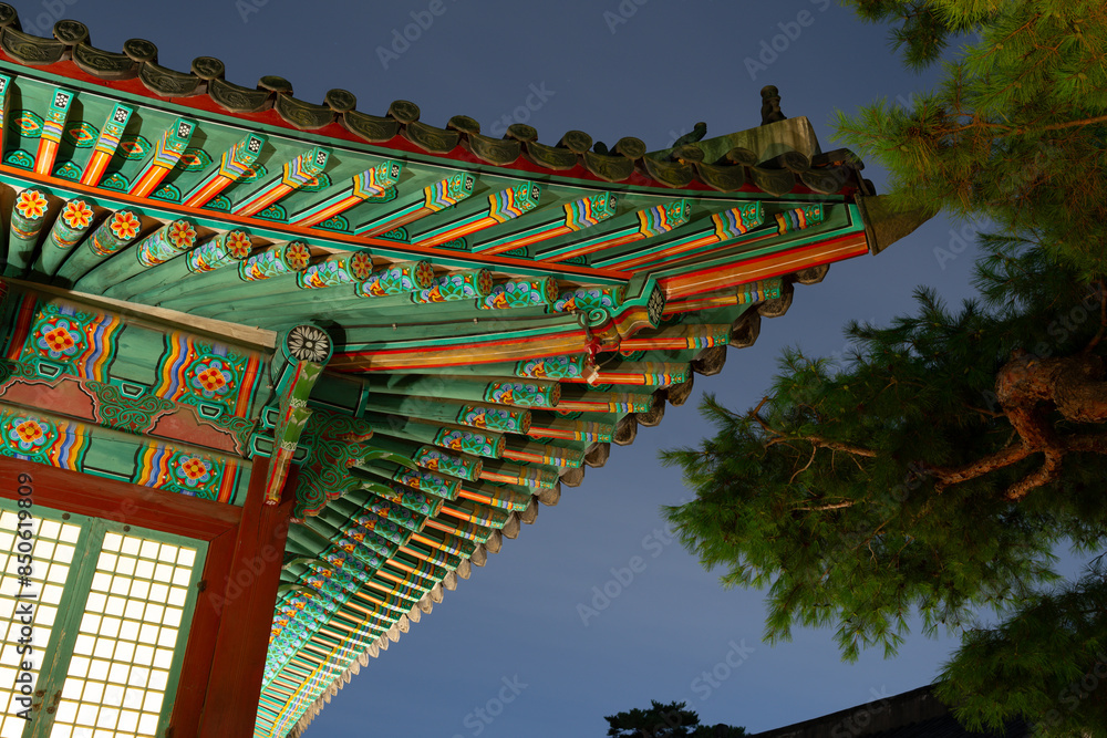 Wall mural night of changgyeonggung palace, traditional roof in seoul, korea