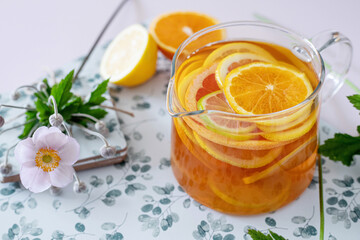 Black tea with fresh oranges
