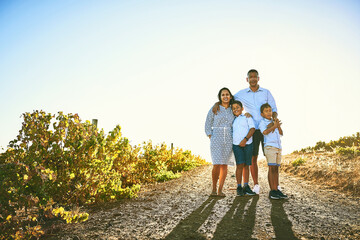 Fototapeta premium Family, people and portrait on vacation, holiday or travel in Tuscany for bonding, memory and support. Woman, man and children in outdoor for together, growth and development with flare in Italy