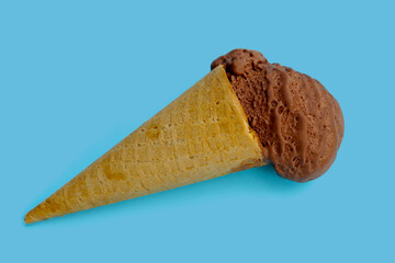 Chocolate ice cream on blue background.