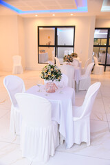 interior of a restaurant, room, luxury hotel room,  room interior, flower decoration, decorated table, table setting, birthday party, ballroom, assembly room
