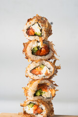 Pyramid of sushi rolls with tuna shavings