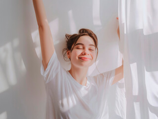 Fototapeta premium Happy young woman stretching in bed waking up alone happy concept, in cozy comfortable bedroom, enjoy good morning