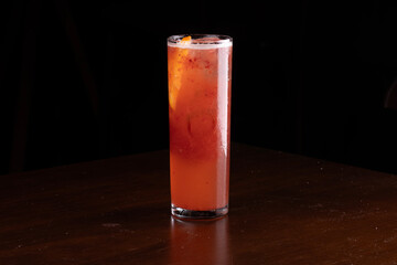 long drink glass with refreshing red fruit cocktail