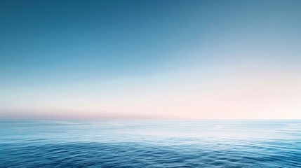 Fototapeta premium Background of a clear sky with a soft gradient from blue to white at the horizon