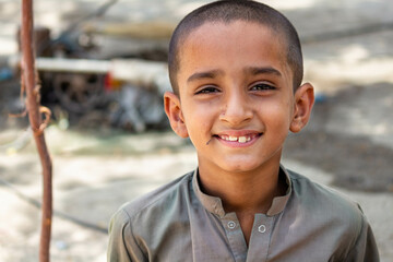 Cute Asian boy smiling with a very happy expression on his face