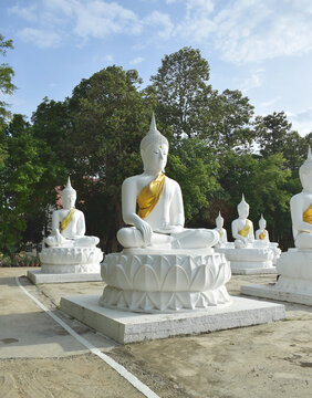 The white Buddha statue was created by a devotee for a Buddhist temple.Thailand, Khemmarat, Ubon ratchathani