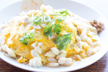 Thai Basil Pork and Crab Omelette Rice with coriander on top