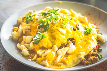 Thai Basil Pork and Crab Omelette Rice with coriander on top