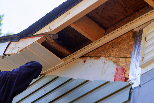 Ceiling house vinyl soffit plastic boards are mounted to roof rafters