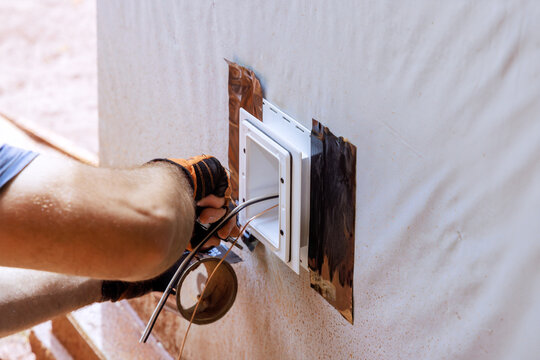 Weatherproof deep plastic electrical box is mounted on outside wall