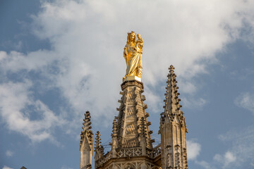 Golden statue of the Virgin at Pey Berland Tower, Bordeaux Cathedral, France