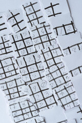 torn paper grid pieces with numbers