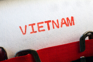Vietnam typed on typewriter on red. Vietnam is a Southeast Asian country known for its beaches, rivers, Buddhist pagodas and bustling cities