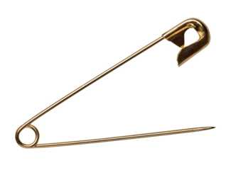 Golden metal safety pin on isolated background