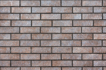 Brick wall of modern building. There is beautiful glaze on the surface. Background. Texture.