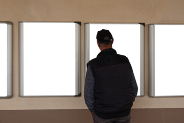 man looking at copy space for advertisements on wall.