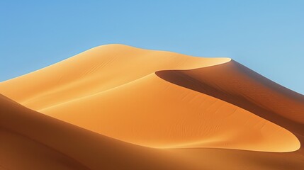 Dunes in the desert, smooth curves of sand dune with clear blue sky