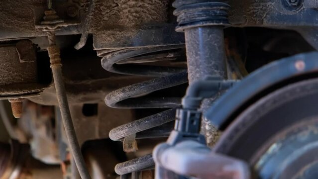 Shock absorber strut with coil spring, modern car suspension system