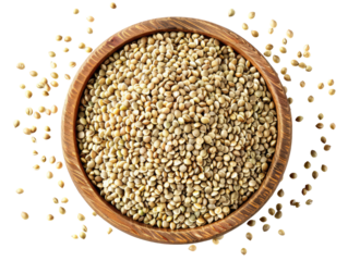 Top view of A wooden bowl filled with hemp heart seeds, scattered on a white background.