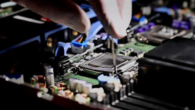 CPU, Processor installation. Semiconductor components in the high technology sector. Printed circuit board with chipset.