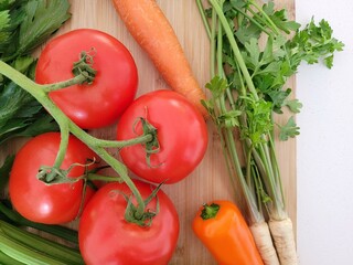 Yummy tomatoes, carrot, orange paprika and parsley.