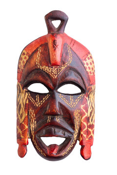 Carved wooden mask in brown and red colors. Souvenir, symbol of the culture of Kenya, Africa. Isolated on transparent background.