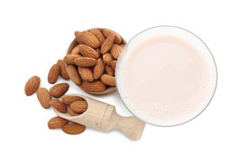 Glass of almond milk and almonds isolated on white, top view