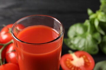 Fresh tomato juice in glass on table, closeup