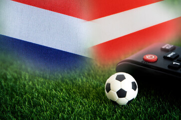 football match , Netherlands vs Austria , Football Nation Flag and soccer ball on green grass