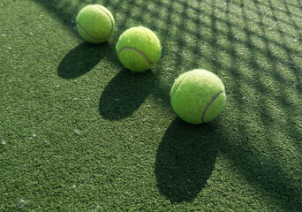  tennis ball back light shadow on tennis grass court good for background